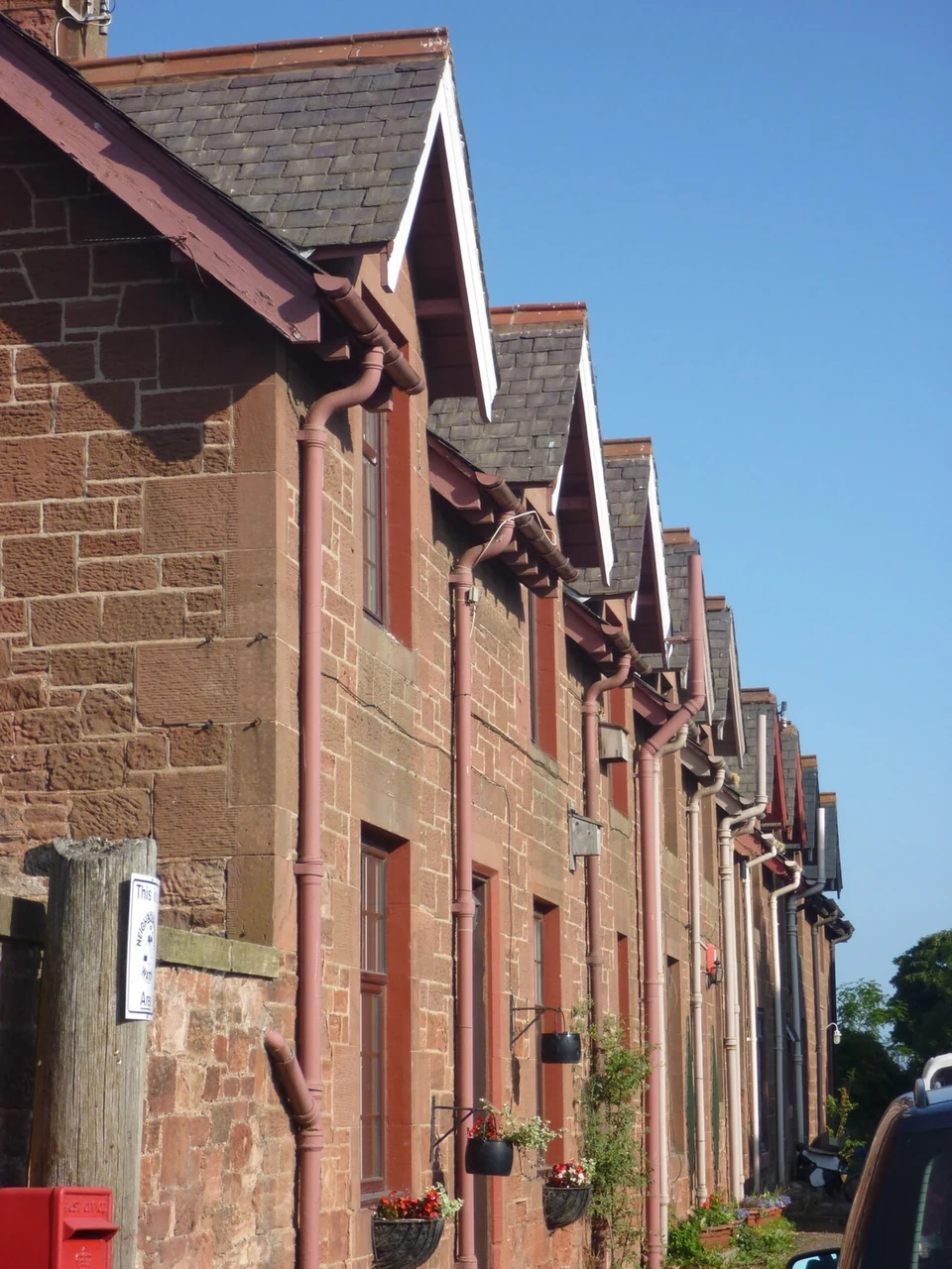 External gutters and downpipes on a residential elevation