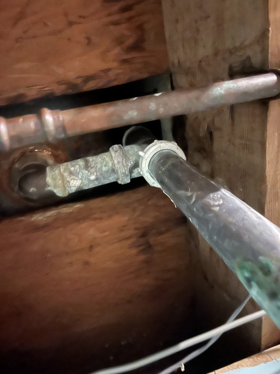 Close view of a damaged metal pipe connection