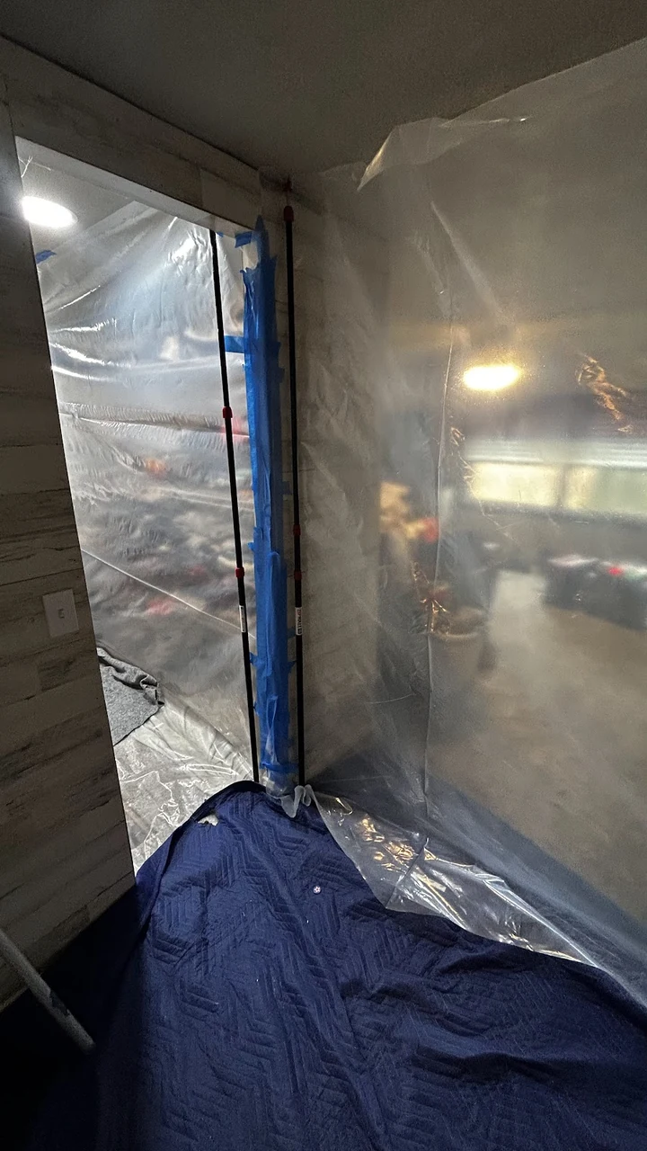 Protective sheeting separating a restoration work area